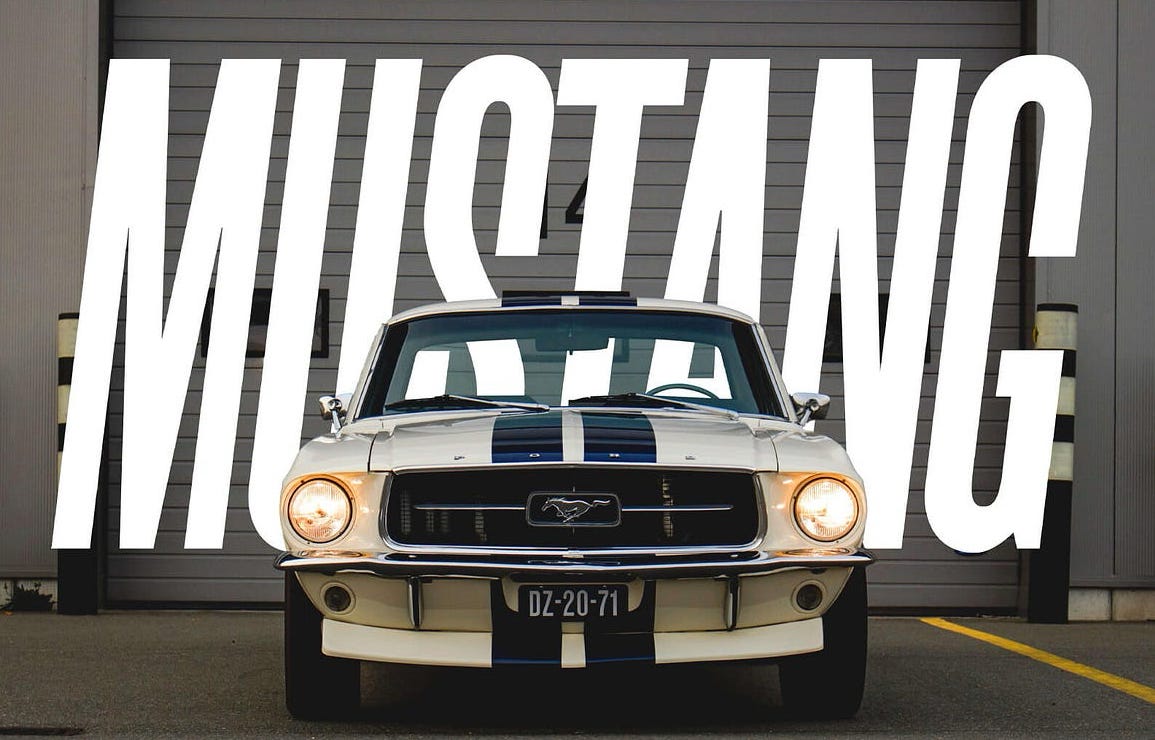 Sports car photograph with bold modern typography layered behind the vehicle roofline